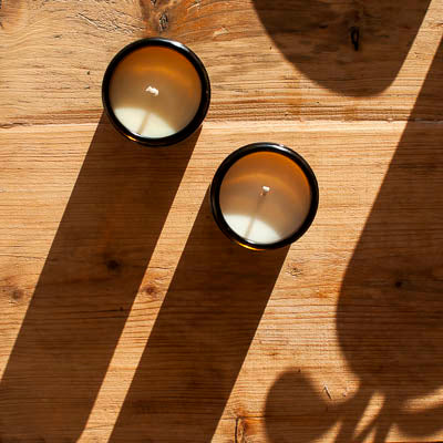 essential oil candles in amber jars